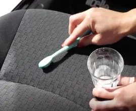 Got a stain in your car upholstery? Try removing it with this quick and easy trick!