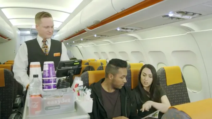 Ever wonder about those strange hand signals cabin crew use on planes? This is what they mean!