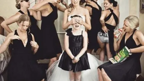Notice anything strange about this old black and white photo? When we saw it, it gave us the creeps...