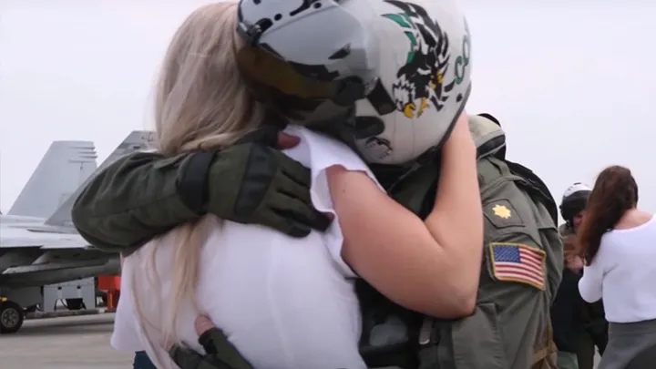 This fighter jet pilot was away for months, he freaks out when he sees his wife again