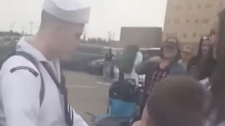 A Marine rushes home to greet his wife, but is surprised when he sees her