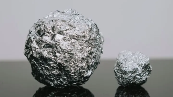 Here’s why you should put a ball of aluminum foil in your dishwasher