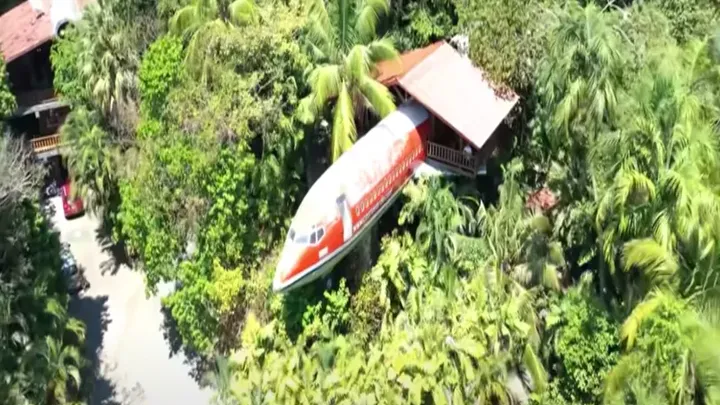 An airplane in the middle of the jungle has been converted into a beautiful holiday home