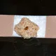 She puts a piece of bread on her child's plaster for a trick we didn't know yet!