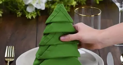 This is how you can fold regular napkins into cute Christmas trees