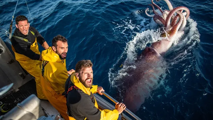 Fishermen Take Photo on Boat – What’s in the Water Behind Them Leaves Everyone Speechless