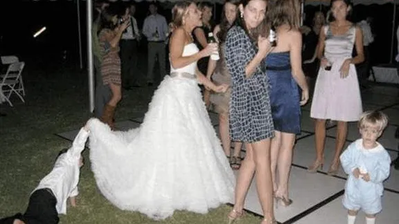 Notice anything strange about this old black and white photo? When we saw it, it gave us the creeps...