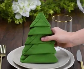 This is how you can fold regular napkins into cute Christmas trees