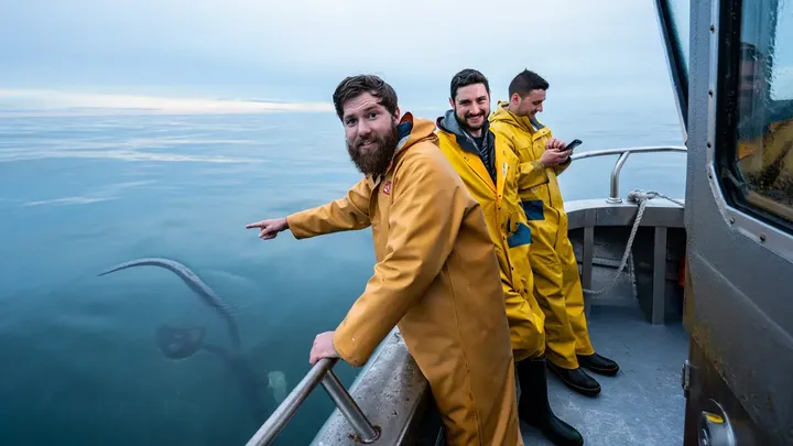 Fishermen Take Photo on Boat – What’s in the Water Behind Them Leaves Everyone Speechless