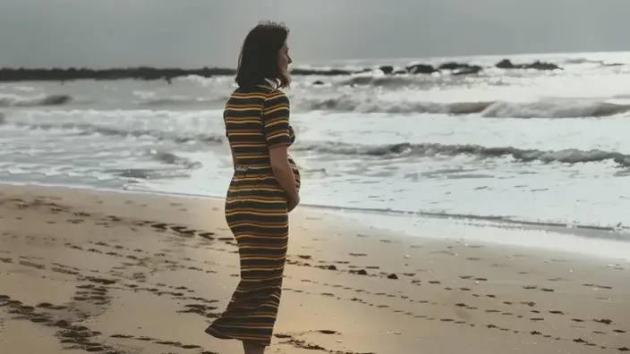 Man photographs pregnant wife but sees something startling in the background